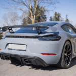 Back Porsche Cayman GT4 on Lake Constance