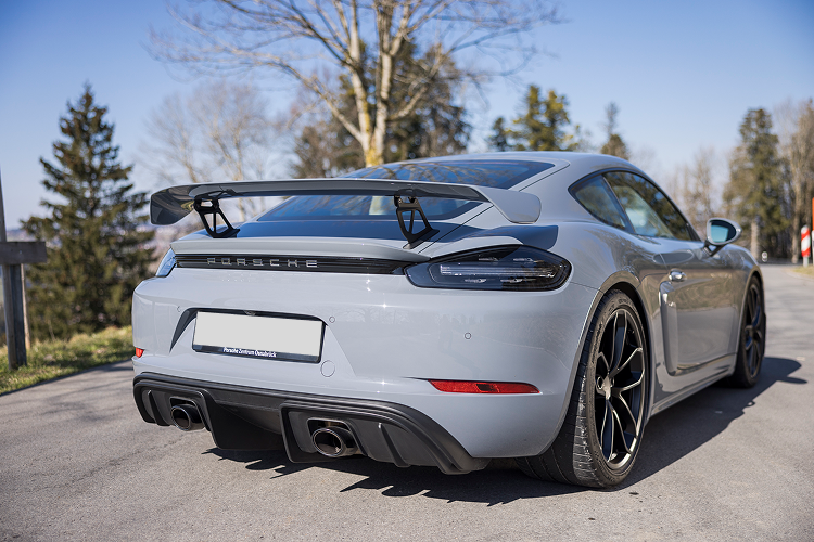 Back Porsche Cayman GT4 on Lake Constance