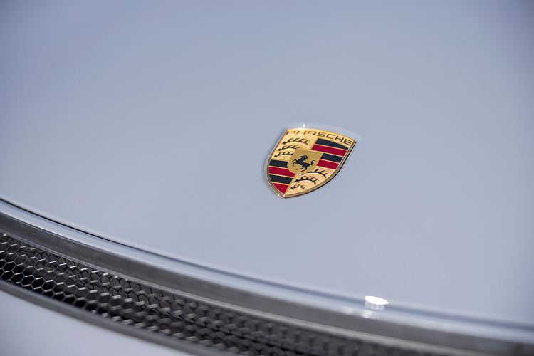 Logo front Porsche Cayman GT4 on Lake Constance
